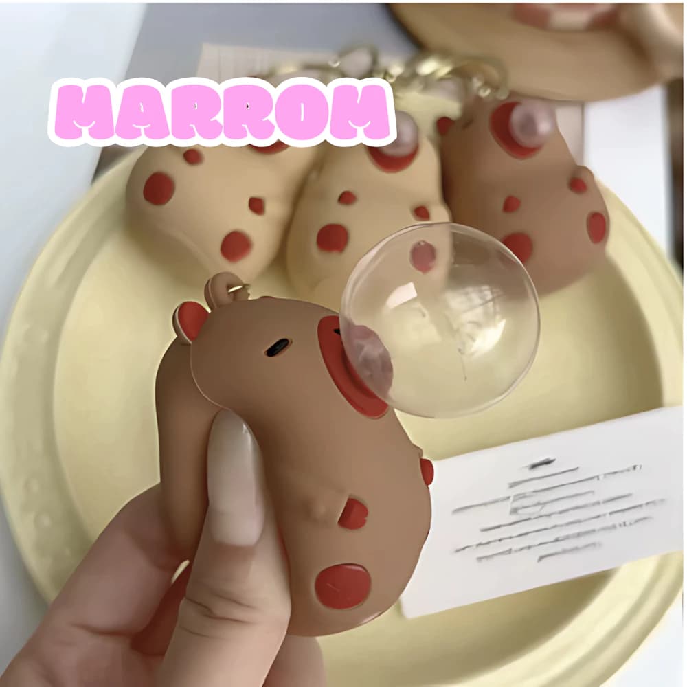 Adorável chaveiro de Capivara com divertido recurso antiestresse de disparo de bolhas..